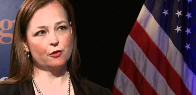 Jenny Beth Martin in front of red white and blue flag