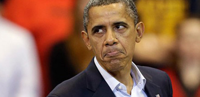 Obama frowning with a blurry background.